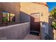 Private condo entry with brown door and small balcony at 5122 E Shea Blvd # 2054, Scottsdale, AZ 85254