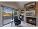 Cozy living room features a fireplace and sliding glass doors to a private balcony at 5122 E Shea Blvd # 2054, Scottsdale, AZ 85254