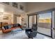 Living room with sliding glass doors leading to a patio overlooking golf course at 5122 E Shea Blvd # 2054, Scottsdale, AZ 85254