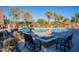 Community pool with lounge chairs and fire pit at 5122 E Shea Blvd # 2054, Scottsdale, AZ 85254