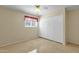 Bedroom with tile floors and large closet at 537 W El Caminito Dr, Phoenix, AZ 85021