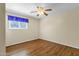 Bright bedroom with hardwood floors and ceiling fan at 537 W El Caminito Dr, Phoenix, AZ 85021