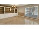 Dining room with built-in shelving and window with shutters at 537 W El Caminito Dr, Phoenix, AZ 85021