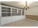 Formal dining room with built-in shelving and patterned wall at 537 W El Caminito Dr, Phoenix, AZ 85021