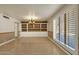 Spacious dining area with built-in shelving and large windows at 537 W El Caminito Dr, Phoenix, AZ 85021