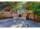 Stone outdoor fireplace and patio area at 537 W El Caminito Dr, Phoenix, AZ 85021