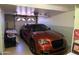 Garage with orange car and storage at 537 W El Caminito Dr, Phoenix, AZ 85021