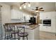 Kitchen with granite countertops, white cabinets, and an island with seating at 537 W El Caminito Dr, Phoenix, AZ 85021