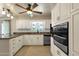 Spacious kitchen featuring granite countertops and white cabinets at 537 W El Caminito Dr, Phoenix, AZ 85021