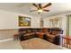 Spacious living room featuring a large sectional sofa and tile flooring at 537 W El Caminito Dr, Phoenix, AZ 85021