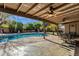 Inviting kidney shaped pool with covered patio and seating area at 537 W El Caminito Dr, Phoenix, AZ 85021