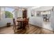 Quaint dining area with wood table and chairs, offering kitchen views at 5646 E Player Pl, Mesa, AZ 85215