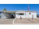 Front view of a white manufactured home with carport and desert landscaping at 5646 E Player Pl, Mesa, AZ 85215