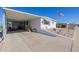 White manufactured home with covered patio and gravel landscaping at 5646 E Player Pl, Mesa, AZ 85215