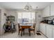 Kitchen with white cabinets, breakfast nook, and a view of the community at 5646 E Player Pl, Mesa, AZ 85215