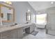 Elegant bathroom with double vanity, soaking tub, and shower at 5714 E Paradise Ln, Scottsdale, AZ 85254