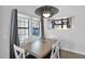 Bright dining room with light wood table and gray curtains at 5714 E Paradise Ln, Scottsdale, AZ 85254