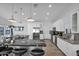 Modern kitchen with white cabinets, granite countertops, and stainless steel appliances at 5714 E Paradise Ln, Scottsdale, AZ 85254