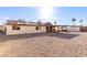 Large backyard with gravel, covered patio, and house view at 6026 W Juniper Ave, Glendale, AZ 85306