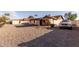 Large backyard with gravel landscaping and storage shed at 6026 W Juniper Ave, Glendale, AZ 85306