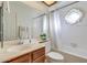 Bathroom with tub, shower, and wood vanity at 6026 W Juniper Ave, Glendale, AZ 85306