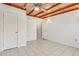 Bedroom with tile flooring and double closets at 6026 W Juniper Ave, Glendale, AZ 85306