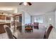 Dining room adjacent to kitchen with a view of the backyard at 6026 W Juniper Ave, Glendale, AZ 85306