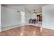 Dining area with hardwood floors and a view into the Gathering room at 6026 W Juniper Ave, Glendale, AZ 85306