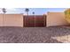 Wooden gate provides access to the backyard at 6026 W Juniper Ave, Glendale, AZ 85306