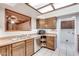 Bright kitchen with wood cabinets, stainless steel appliances, and ample counter space at 6026 W Juniper Ave, Glendale, AZ 85306