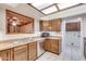 Kitchen with wood cabinets, stainless steel appliances, and tiled floor at 6026 W Juniper Ave, Glendale, AZ 85306