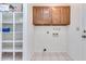 Laundry room with upper cabinets and shelving at 6026 W Juniper Ave, Glendale, AZ 85306