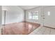 Bright living room with hardwood floors and large window at 6026 W Juniper Ave, Glendale, AZ 85306