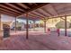 Covered patio with pergola, seating area, and built-in grill at 6026 W Juniper Ave, Glendale, AZ 85306