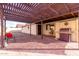 Spacious patio with pergola, seating, and a built-in grill at 6026 W Juniper Ave, Glendale, AZ 85306