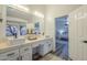 Double vanity bathroom with modern sinks and a view to the bedroom at 605 S 30Th Cir, Mesa, AZ 85204