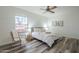 Cozy bedroom with a queen bed and wicker accent chair at 605 S 30Th Cir, Mesa, AZ 85204