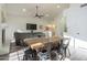 Bright dining area with farmhouse table and chairs near the living room at 605 S 30Th Cir, Mesa, AZ 85204