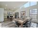 Farmhouse dining table with black metal chairs in open concept kitchen at 605 S 30Th Cir, Mesa, AZ 85204