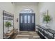 Inviting entryway with coat rack and storage bench at 605 S 30Th Cir, Mesa, AZ 85204