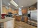 Bright kitchen with stainless steel appliances and wood cabinets at 650 N Hawes Rd # 4430, Mesa, AZ 85207