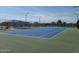 Well-lit tennis court with seating at 650 N Hawes Rd # 4430, Mesa, AZ 85207