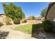 Spacious backyard with mature trees and flowering bushes at 6602 W Prickly Pear Trl, Phoenix, AZ 85083