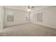 Bedroom with ceiling fan and multiple windows at 6602 W Prickly Pear Trl, Phoenix, AZ 85083