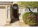 Tan house exterior with dark brown front door and walkway at 6602 W Prickly Pear Trl, Phoenix, AZ 85083