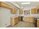 Kitchen with wood cabinets, stainless steel appliances, and tile flooring at 6602 W Prickly Pear Trl, Phoenix, AZ 85083