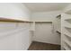 Large walk-in closet with hanging rods and shelves at 6602 W Prickly Pear Trl, Phoenix, AZ 85083