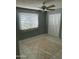 Spacious bedroom with tile floors, a window with blinds, and double-door closet at 6711 W Osborn Rd # 96, Phoenix, AZ 85033