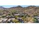 Aerial view of house and neighborhood, showcasing surrounding mountain views at 6857 W Juana Dr, Peoria, AZ 85383