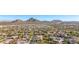 Aerial view of Sonoran Mountain Ranch community, showcasing numerous homes and mountain backdrop at 6857 W Juana Dr, Peoria, AZ 85383